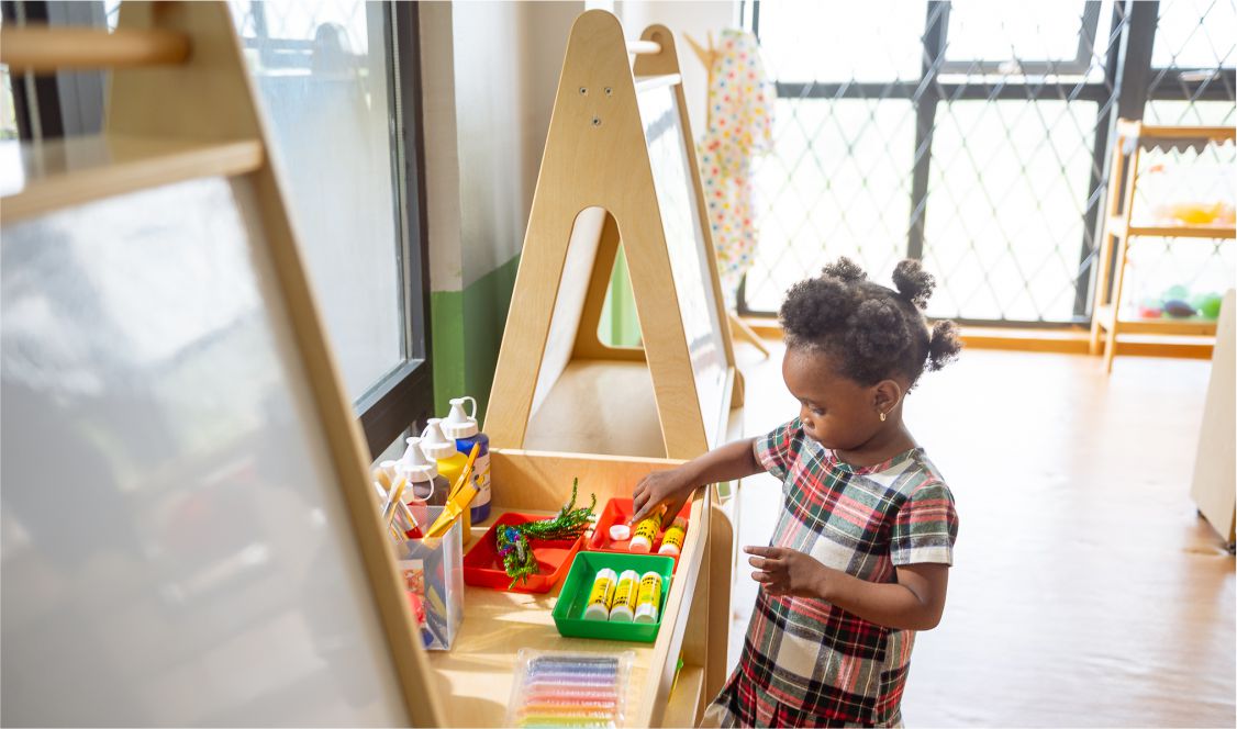 Child playing in a Jewels Leading Lights early years montessori classroom